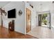 Bright foyer with tile flooring, a modern light fixture, and seamless transition to living spaces at 745 Oak Ln, Orange City, FL 32763