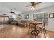 Large open living space with laminate flooring, dining area, and plenty of natural light at 745 Oak Ln, Orange City, FL 32763