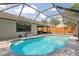 Backyard pool with screened-in enclosure, patio area, and well-maintained landscaping at 745 Oak Ln, Orange City, FL 32763