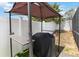 Outdoor barbecue setup with a grill and prep area, perfect for entertaining at 7803 Laurel Oak Ln, Kissimmee, FL 34747