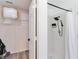 Clean bathroom with closet and shower featuring black fixtures and white tile at 7803 Laurel Oak Ln, Kissimmee, FL 34747