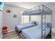 ' bedroom with unique bunk beds, superhero decor, and durable flooring at 7803 Laurel Oak Ln, Kissimmee, FL 34747