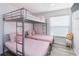 Charming bedroom with a bunk bed and fun, playful decor at 7803 Laurel Oak Ln, Kissimmee, FL 34747