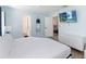 Comfortable bedroom featuring light blue walls, television and white furniture at 7803 Laurel Oak Ln, Kissimmee, FL 34747