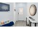 Bright foyer features elegant decor, stylish mirror, and a welcoming atmosphere at 7803 Laurel Oak Ln, Kissimmee, FL 34747