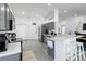Modern kitchen features gray cabinets, stainless steel appliances, and open layout perfect for entertaining at 7803 Laurel Oak Ln, Kissimmee, FL 34747