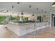 Community bar with ample seating and a view of the pool and surrounding landscape at 8001 Cool Breeze Dr # 118, Orlando, FL 32819
