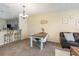Comfortable dining area with bar seating, open to kitchen and living room, perfect for casual meals at 8001 Cool Breeze Dr # 118, Orlando, FL 32819
