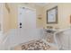 Bright entryway with stylish decor, featuring a decorative console table and warm, inviting tones at 8001 Cool Breeze Dr # 118, Orlando, FL 32819