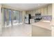 A sunlit kitchen with plenty of counter space, stainless steel appliances and easy access to a private balcony at 8001 Cool Breeze Dr # 118, Orlando, FL 32819