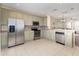 A well-appointed kitchen features stainless steel appliances, ample cabinets, and a stylish backsplash at 8001 Cool Breeze Dr # 118, Orlando, FL 32819