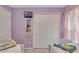 ' bedroom featuring twin beds with themed bedding, a closet, and a small television at 8471 Secret Key Cv, Kissimmee, FL 34747