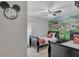 Charming bedroom with Mickey Mouse themed decor and two twin beds at 8471 Secret Key Cv, Kissimmee, FL 34747