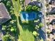 Aerial view of tennis court near residential properties at 8761 The Esplanade # 6, Orlando, FL 32836