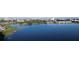 Expansive aerial view of lakefront homes and community amenities with beautiful lake views at 8761 The Esplanade # 6, Orlando, FL 32836
