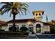 Community clubhouse with well-manicured landscaping provides a welcoming gathering space at 8761 The Esplanade # 6, Orlando, FL 32836