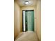 A private entryway with a green door and modern smart lock at 8761 The Esplanade # 6, Orlando, FL 32836