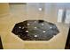 Stunning marble floors in foyer with decorative tile accent at 8761 The Esplanade # 6, Orlando, FL 32836
