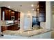 The kitchen boasts granite countertops, stainless steel appliances, and wood cabinetry at 8761 The Esplanade # 6, Orlando, FL 32836