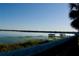 Scenic lake view featuring a private dock, lush shoreline, and tranquil waters, creating a serene retreat at 8761 The Esplanade # 6, Orlando, FL 32836