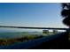 Scenic lake view featuring a private dock, lush shoreline, and tranquil waters, creating a serene retreat at 8761 The Esplanade # 6, Orlando, FL 32836