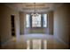 Sun-filled living room featuring large bay window, neutral walls, crown molding and tile floors at 8761 The Esplanade # 6, Orlando, FL 32836
