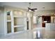 Open-concept living room featuring custom built-ins and seamless access to the modern kitchen at 8761 The Esplanade # 6, Orlando, FL 32836
