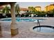 Relaxing community pool with a spa and ample seating for residents to unwind at 8761 The Esplanade # 6, Orlando, FL 32836