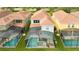 Aerial view of property featuring a private screened pool, spa, and backyard at 9004 Majesty Palm Rd, Kissimmee, FL 34747