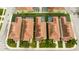 An aerial view of townhome roofs, back patios, and shared pool amenities in the community at 9004 Majesty Palm Rd, Kissimmee, FL 34747