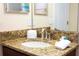 Close-up of bathroom granite counter with white sink and towels at 9004 Majesty Palm Rd, Kissimmee, FL 34747