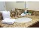 Bathroom vanity has a stone countertop, stainless steel faucet and decorative plants at 9004 Majesty Palm Rd, Kissimmee, FL 34747