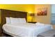Comfortable bedroom with a king bed, soft bedding, and neutral decor at 9004 Majesty Palm Rd, Kissimmee, FL 34747