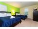Bedroom with two twin beds and ample natural light at 9004 Majesty Palm Rd, Kissimmee, FL 34747