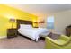 Inviting bedroom with a king-size bed, soft lighting, and a comfortable seating area at 9004 Majesty Palm Rd, Kissimmee, FL 34747