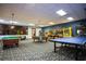 The game room includes pool tables, ping pong table, and arcade games for entertainment at 9004 Majesty Palm Rd, Kissimmee, FL 34747