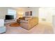 Comfortable living room featuring a sectional sofa, TV, and colorful artwork at 9004 Majesty Palm Rd, Kissimmee, FL 34747