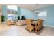 Open-concept living and dining areas featuring tile flooring, high ceilings and comfortable furniture at 9004 Majesty Palm Rd, Kissimmee, FL 34747