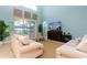 Bright living room features a sliding glass door and comfortable seating at 9004 Majesty Palm Rd, Kissimmee, FL 34747