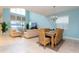 Open-concept living and dining areas featuring tile flooring, high ceilings and comfortable furniture at 9004 Majesty Palm Rd, Kissimmee, FL 34747