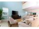 Open concept living room with neutral decor, seamlessly flows into dining area at 9004 Majesty Palm Rd, Kissimmee, FL 34747