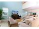Open concept living room with neutral decor, seamlessly flows into dining area at 9004 Majesty Palm Rd, Kissimmee, FL 34747