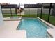 Private screened in-ground pool with an attached spa in a fully enclosed backyard with patio space at 9004 Majesty Palm Rd, Kissimmee, FL 34747