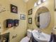 Well-lit half bath features updated fixtures, vanity, and decorative accents, creating a stylish and functional space at 925 Counts Crest Cir, Apopka, FL 32712