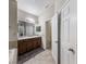 Bathroom features a double sink vanity with plenty of counter space and a shower at 925 Counts Crest Cir, Apopka, FL 32712