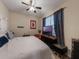 This bedroom has a ceiling fan and a lot of natural light at 925 Counts Crest Cir, Apopka, FL 32712