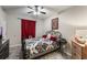 This bedroom has a decorative comforter and striking red curtains at 925 Counts Crest Cir, Apopka, FL 32712