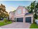 Charming two-story home with a three-car garage and brick driveway and manicured lawn at 925 Counts Crest Cir, Apopka, FL 32712