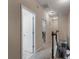 Upstairs hallway with neutral walls, carpet and wood railing overlooking the stairwell at 925 Counts Crest Cir, Apopka, FL 32712