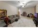 Spacious living room with ample seating, ceiling fan and plenty of natural light at 925 Counts Crest Cir, Apopka, FL 32712